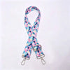 A pink and blue checkered nylon shoulder strap for bags and purses.