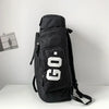 Black waterproof travel gym backpack featuring a white GO logo and skateboard straps.