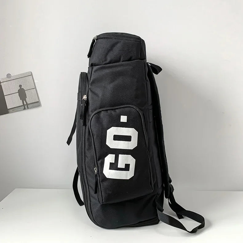 Black waterproof travel gym backpack featuring a white GO logo and skateboard straps.