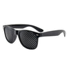 Black precision vision correction glasses with a perforated lens and dark frame.