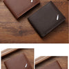 A brown slim leather wallet with a money clip is shown in various angles on a wooden surface.