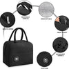 Black insulated canvas lunch bag featuring reinforced handles, inner wipeable lining, front pocket, waterproof surface, and a