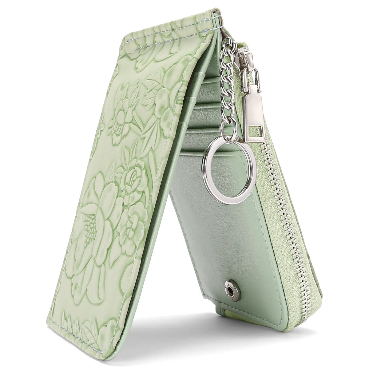A light green ladies zip coin purse with a floral pattern and a silver key ring attached.