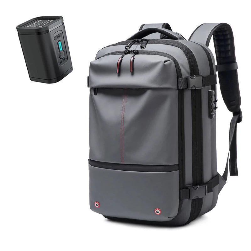 A gray heavy duty laptop backpack with vacuum compression features is shown next to its detached battery unit.
