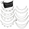 Black leather bag strap with multiple layers of silver chain and decorative pendants
