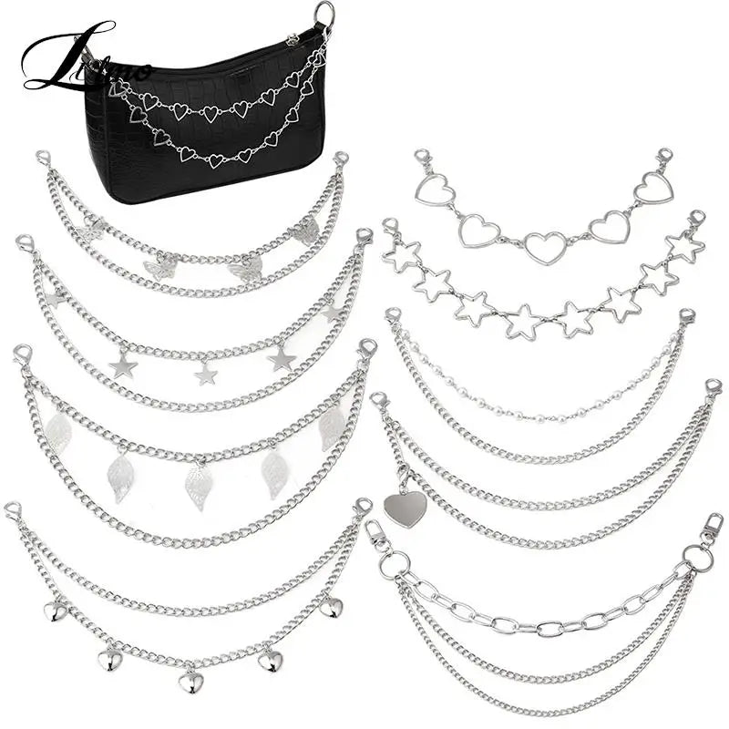 Black leather bag strap with multiple layers of silver chain and decorative pendants