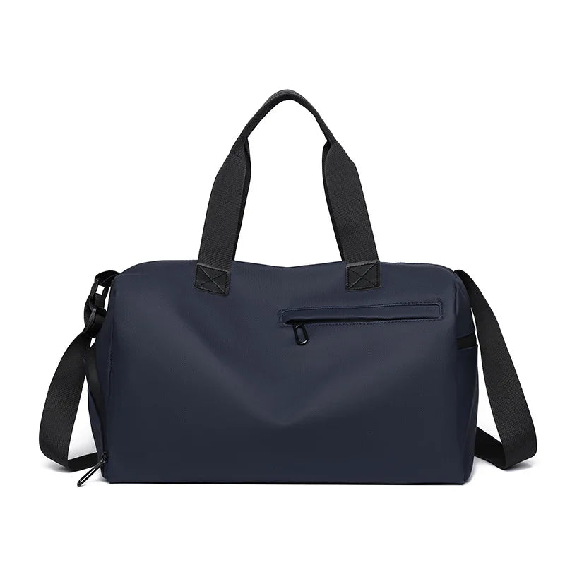 Navy waterproof travel duffle bag with black handles and a separate shoe compartment