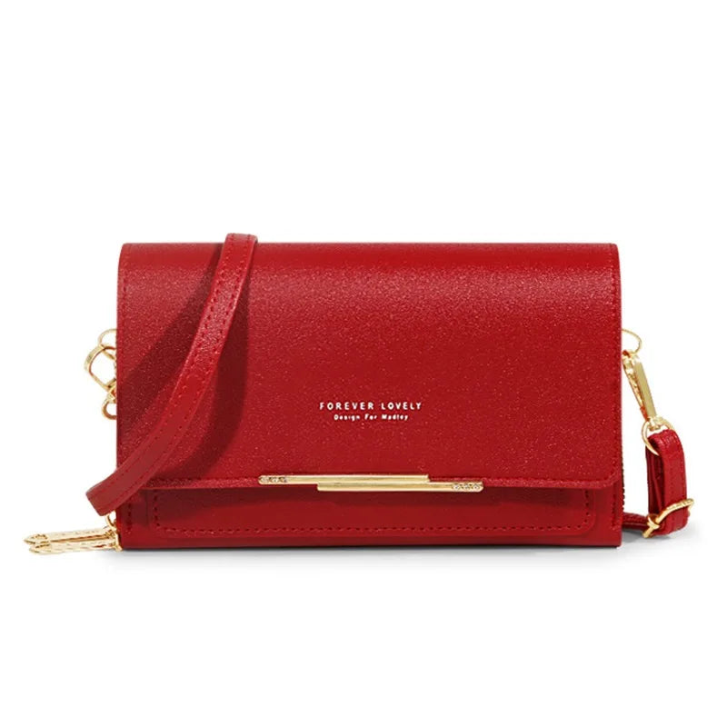 A red textured women's multi-card shoulder wallet with gold hardware.