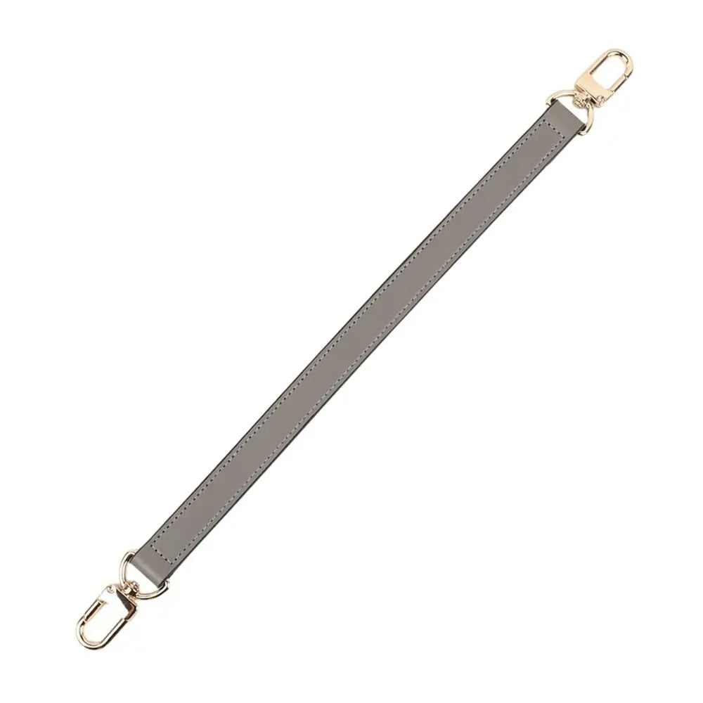 A beige genuine leather replacement shoulder strap with gold-toned hardware.