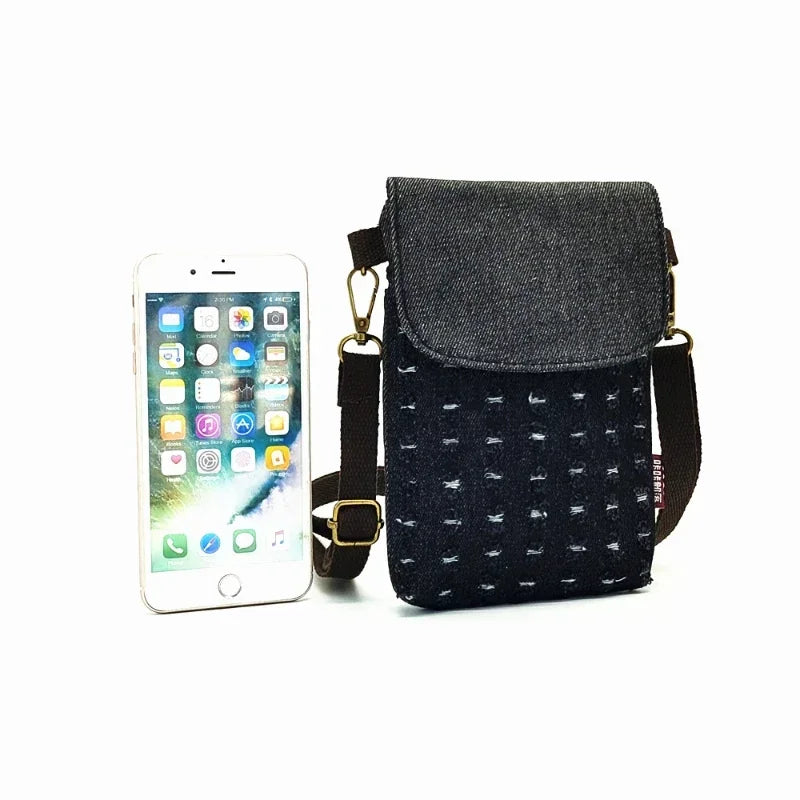 A dark gray denim mini messenger bag with triple-layer storage and a black strap is shown next to an iPhone.