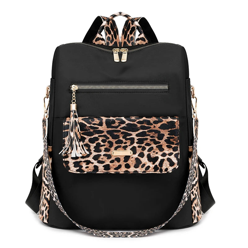 Black fashion backpack with leopard print accents and gold hardware
