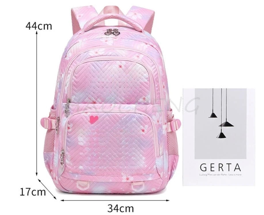 Pink quilted backpack with a floral pattern and pink accents for students