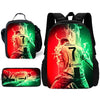 A set of three backpacks featuring a soccer player graphic with glowing green and red effects.