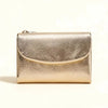 A small, metallic gold leather card holder wallet with a smooth texture, shown against a white background.