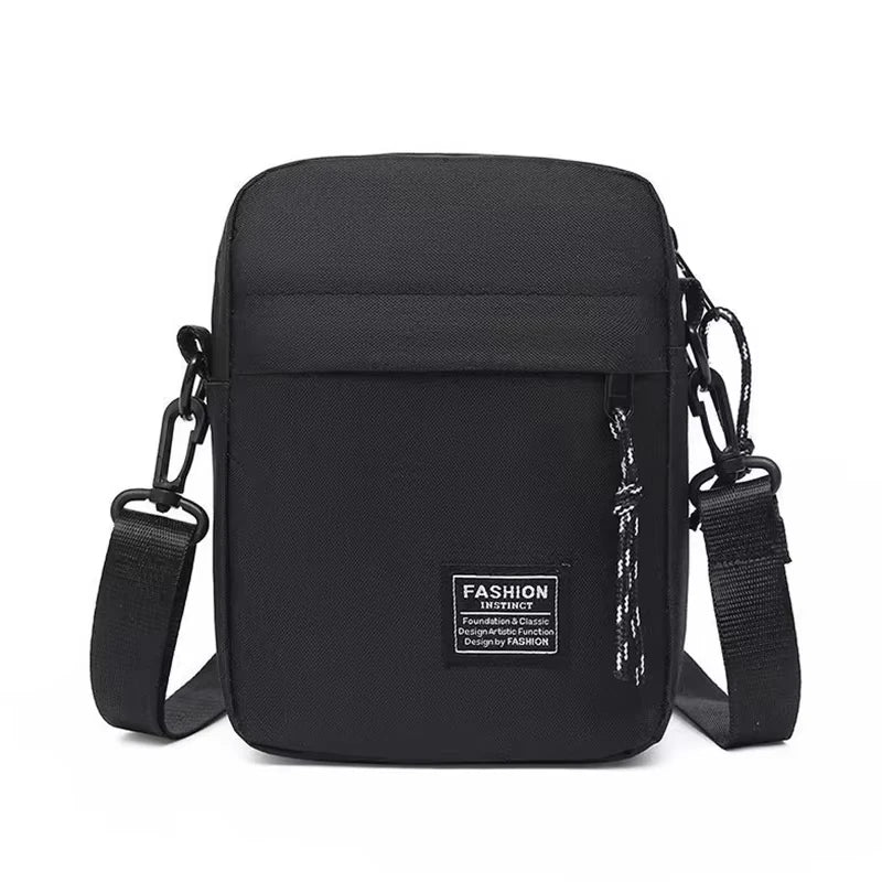 Black minimalist nylon crossbody bag with adjustable strap and leather accents