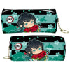A black and teal pencil case featuring a Demon Slayer character design with red flowers.