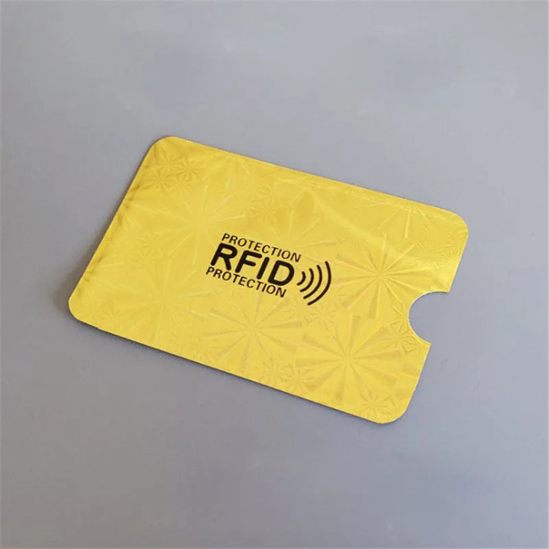 A yellow card holder with the text Protection RFID Protection is shown on a gray surface.