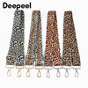 A set of leopard print adjustable crossbody straps for bags shown against a white background.