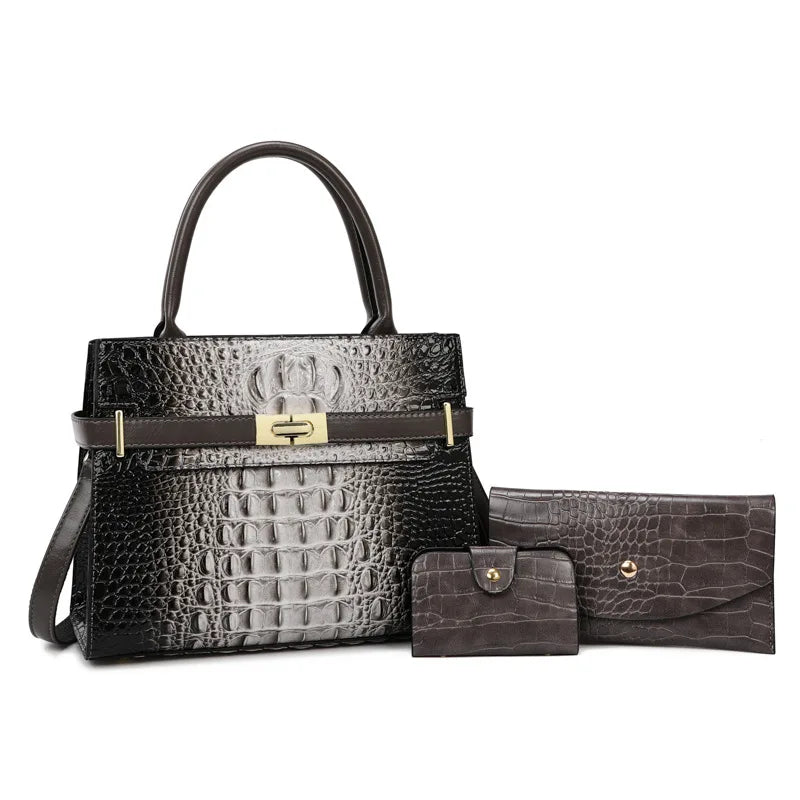 A black crocodile print shoulder handbag and a matching wallet set with a brown leather strap.