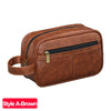 A brown PU leather travel toiletry bag with a zipper and leather strap.