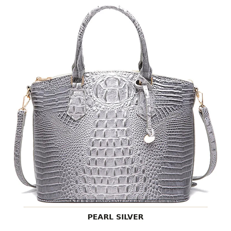 Silberner Krokodillenmuster-Top-Handtasche mit Riemen.