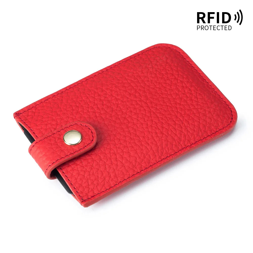 A red genuine leather slim card holder with a stitched texture and a silver-colored metal closure.