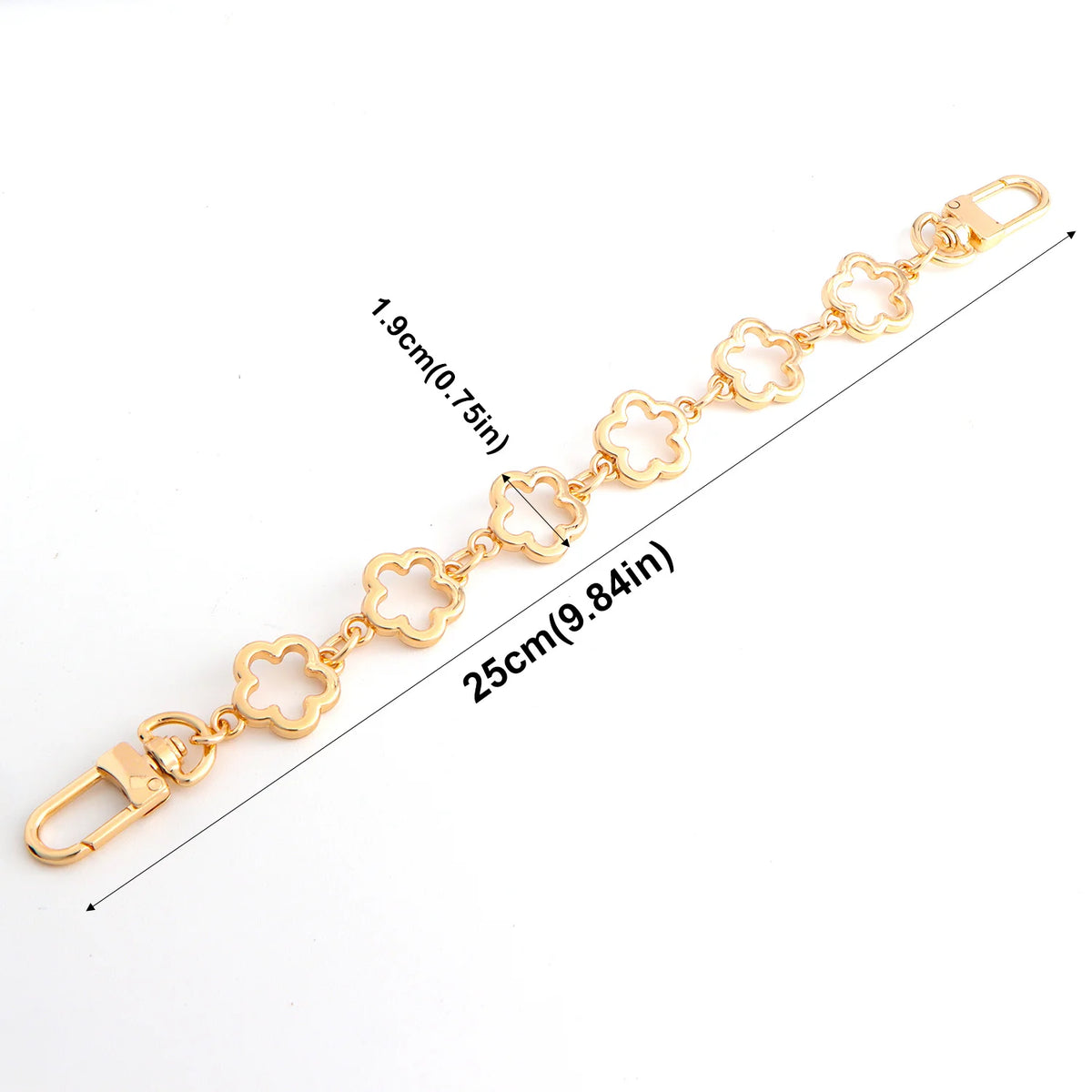 Gold flower bag extender chain measuring 25cm with a clasp and decorative flowers.