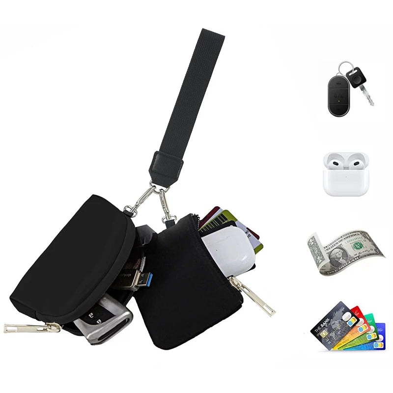 Black dual-zip wristlet wallet with detachable strap and accessories like earbuds and cash