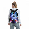 A person is wearing a black backpack featuring a football player design with vibrant colors and flames.