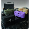 A collection of portable storage cases in olive green, beige, and purple are displayed on a dark surface.