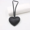 A black PU leather heart-shaped keychain hanging from a loop against a white background.