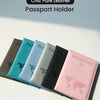A collection of slim PU leather passport holders in various pastel and dark colors displayed on a white surface.