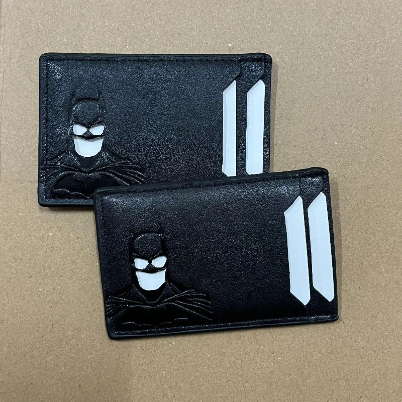 Black leather card holder with a bat design featuring a stylized bat silhouette and vertical cutouts