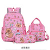 A pink cartoon animal backpack set featuring a bear and other cute characters.
