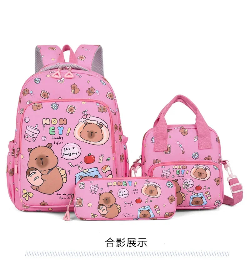 A pink cartoon animal backpack set featuring a bear and other cute characters.