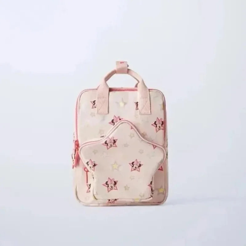 A light pink fashion backpack with a cow print pattern and pink accents.