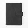 A black genuine PU leather passport and ticket wallet cover with a stitched flap.