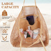 A woven mesh beach tote bag in tan color with shoulder straps, showing its large capacity and interior features.