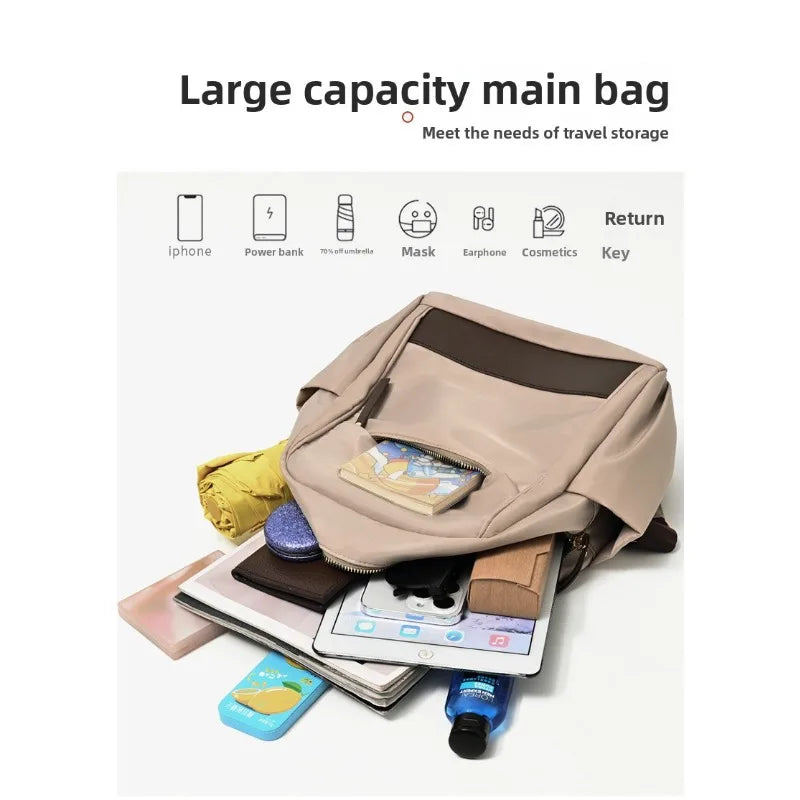 A beige large capacity main bag is shown with various travel items like an iPhone, power bank, mask, and cosmetics.