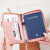 A pink RFID-blocking passport wallet shown in various angles and contexts.