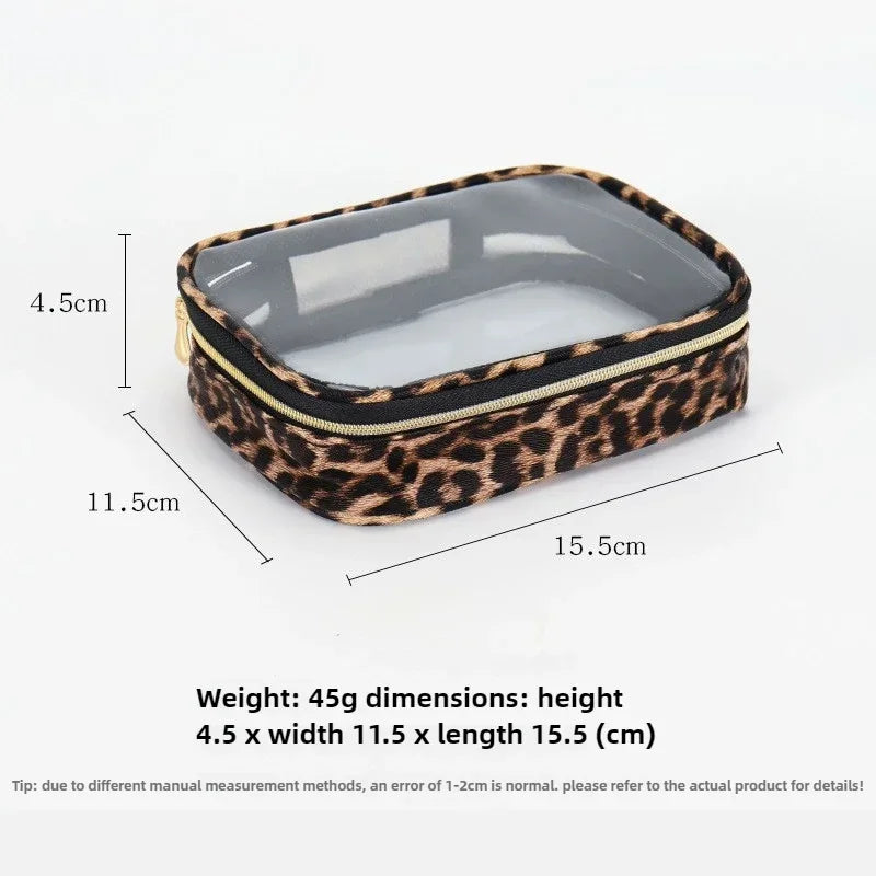 A rectangular leopard print cosmetic organizer bag with a clear lid and black zipper.
