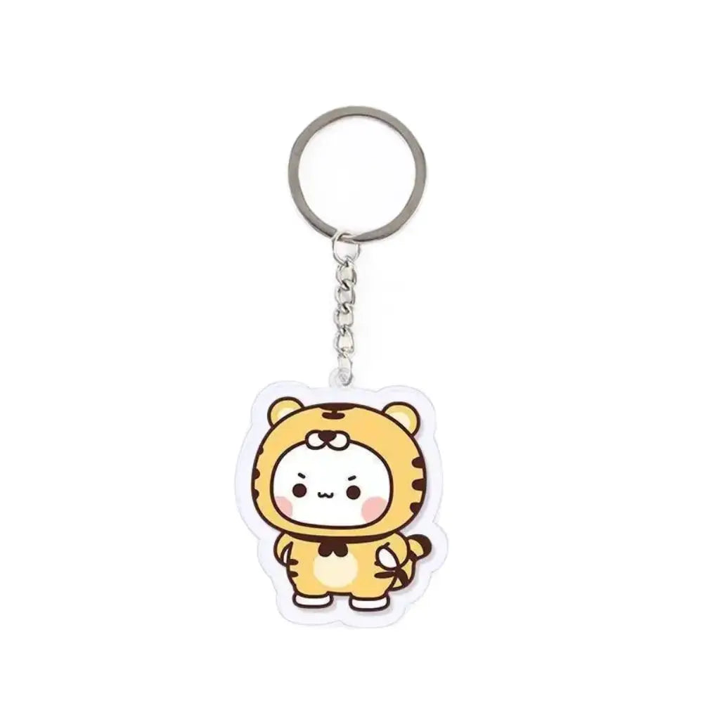 A clear resin keychain charm shaped like a cute cartoon tiger face.