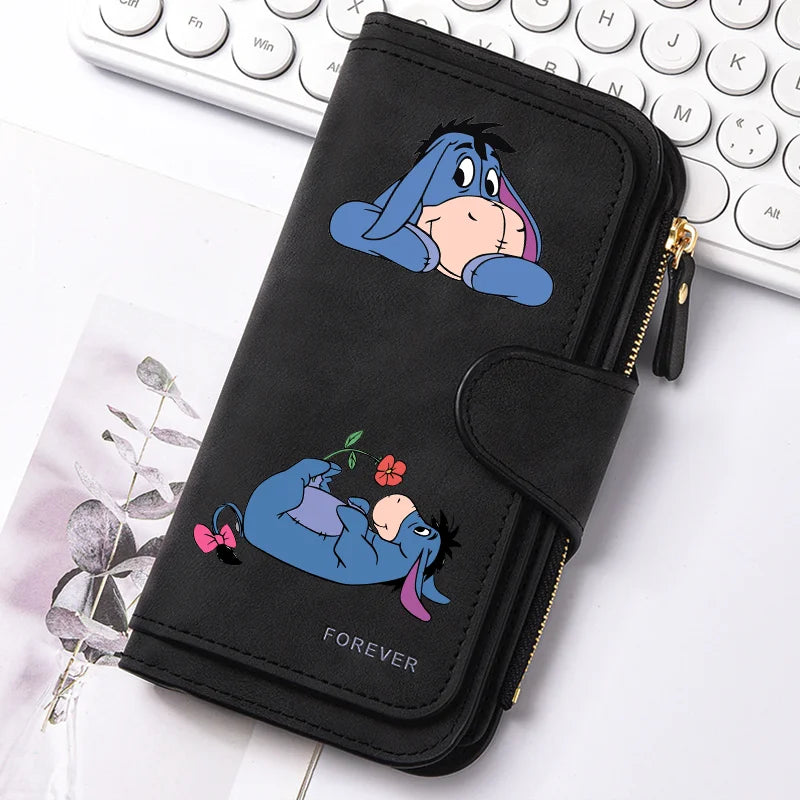 A black zippered pouch featuring a cartoon blue cat sleeping, labeled Forever.