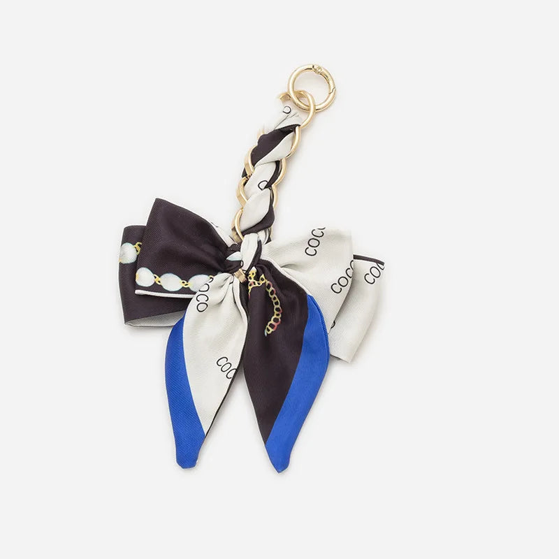 Black and white striped adjustable bag strap with gold hardware