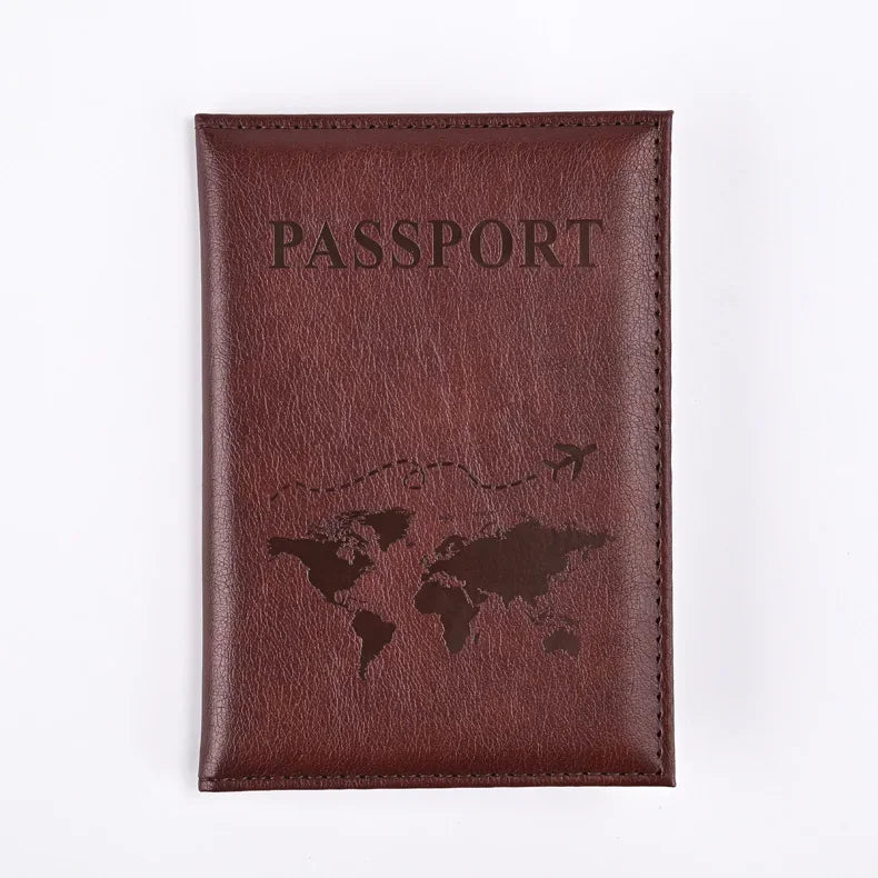 A dark brown leather passport holder embossed with a world map silhouette.