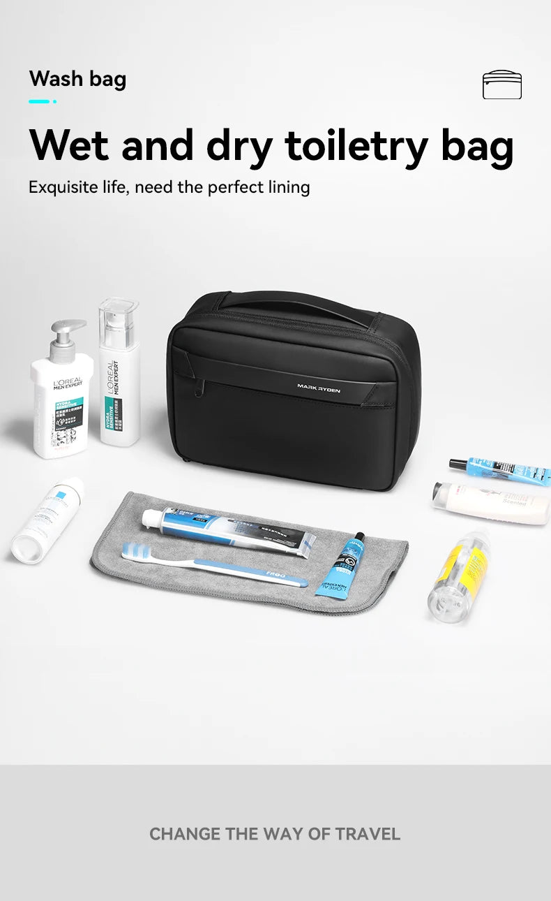 A black wash bag containing various toiletries like bottles and tubes, shown with some items laid out on a gray mat.