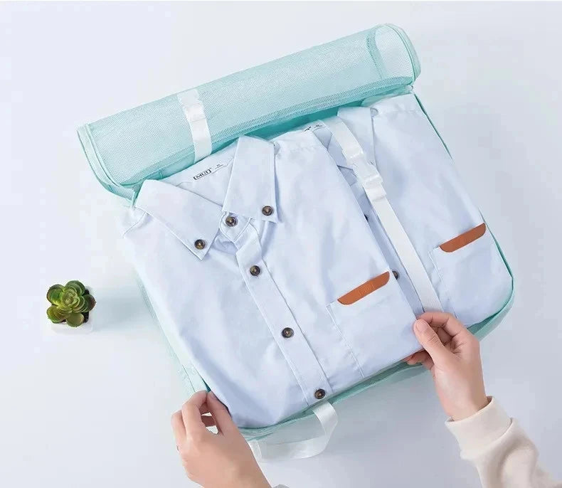 A light blue fabric storage organizer set featuring a shirt and a matching fabric pouch.