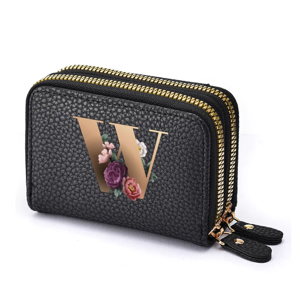 Black mini wallet with a gold letter W print and a double zipper closure