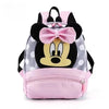 Pink and black Minnie Mouse themed fashion backpack with a cow print design
