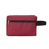 A deep red textured fabric cosmetic bag with a black strap and silver zipper.
